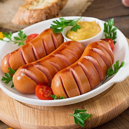 sausages-grill-pan-wooden-table_11zon-scaled.jpg